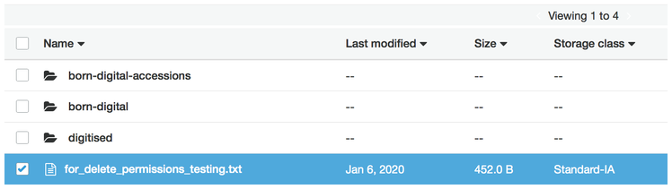 A file listing in the S3 console. Four files are listed: three folders, and one text file highlighted in blue.